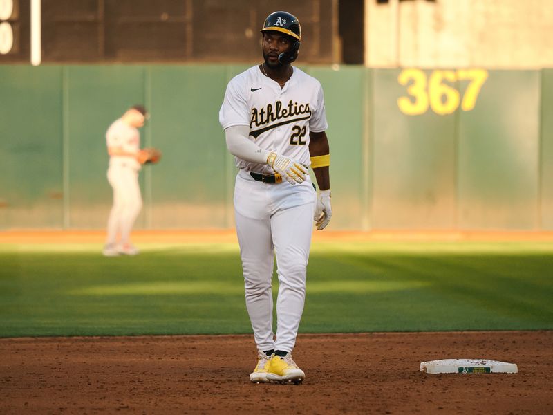 Jul 22, 2024; Oakland, California, USA; Oakland Athletics left fielder Miguel Andujar (22) after hitting a two-run RBI double against the Houston Astros during the third inning at Oakland-Alameda County Coliseum. Mandatory Credit: Kelley L Cox-USA TODAY Sports