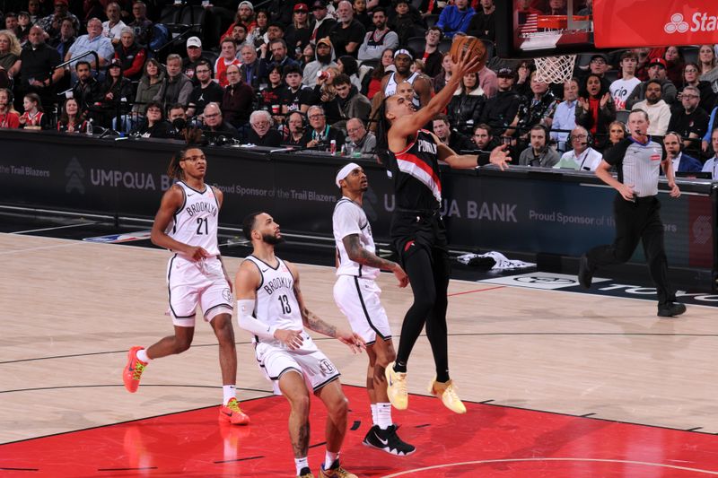 PORTLAND, OR - JANUARY 14: Dalano Banton #5 of the Portland Trail Blazers drives to the basket during the game against the Brooklyn Nets on January 14, 2025 at the Moda Center Arena in Portland, Oregon. NOTE TO USER: User expressly acknowledges and agrees that, by downloading and or using this photograph, user is consenting to the terms and conditions of the Getty Images License Agreement. Mandatory Copyright Notice: Copyright 2025 NBAE (Photo by Cameron Browne/NBAE via Getty Images)