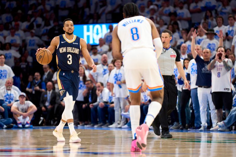 OKLAHOMA CITY, OKLAHOMA - APRIL 21: CJ McCollum #3 of the New Orleans Pelicans brings the ball up court against the Oklahoma City Thunder in game one of the Western Conference First Round Playoffs at the Paycom Center on April 21, 2024 in Oklahoma City, Oklahoma. NOTE TO USER: User expressly acknowledges and agrees that, by downloading and or using this photograph, User is consenting to the terms and conditions of the Getty Images License Agreement.  (Photo by Cooper Neill/Getty Images)