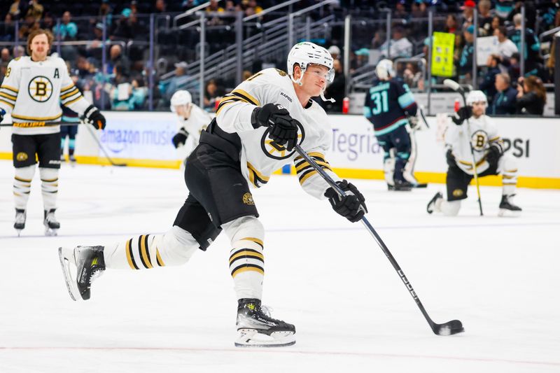 Feb 26, 2024; Seattle, Washington, USA; Boston Bruins center Trent Frederic (11) participates in pregame warmups against the Seattle Kraken at Climate Pledge Arena. Mandatory Credit: Joe Nicholson-USA TODAY Sports