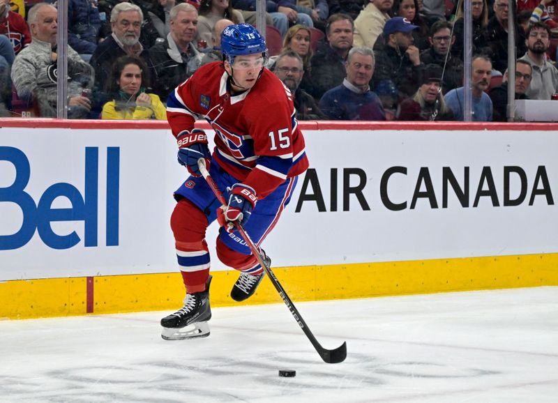 Feb 21, 2024; Montreal, Quebec, CAN; Montreal Canadiens forward Alex Newhook (15) plays the puck against the Buffalo Sabres during the first period at the Bell Centre. Mandatory Credit: Eric Bolte-USA TODAY Sports