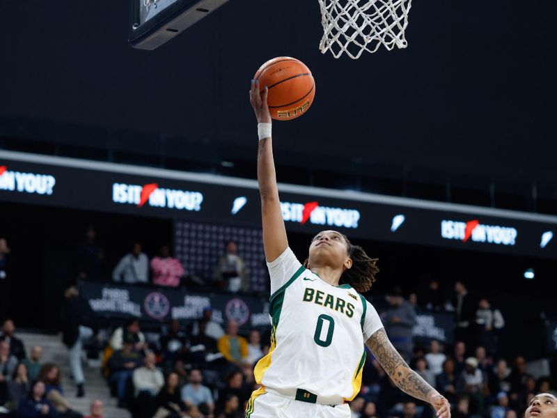 Nov 3, 2025; Paris, FRA;  Baylor guard Taliah Scott (0) scores a layup ahead of Duke guard Riley Nelson (4) during the first half at Adidas Arena. Mandatory Credit: Chris Jones-Imagn Images