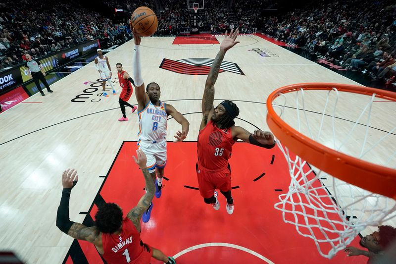 PORTLAND, OREGON - JANUARY 26: Jalen Williams #8 of the Oklahoma City Thunder shoots the ball against Robert Williams III #35 of the Portland Trail Blazers during the second half at Moda Center on January 26, 2025 in Portland, Oregon. NOTE TO USER: User expressly acknowledges and agrees that, by downloading and or using this photograph, User is consenting to the terms and conditions of the Getty Images License Agreement. (Photo by Soobum Im/Getty Images)