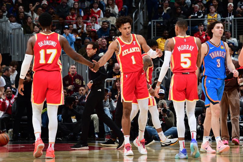 ATLANTA, GA - JANUARY 3: Jalen Johnson #1 of the Atlanta Hawks is congratulated during the game against the Oklahoma City Thunder on January 3, 2024 at State Farm Arena in Atlanta, Georgia.  NOTE TO USER: User expressly acknowledges and agrees that, by downloading and/or using this Photograph, user is consenting to the terms and conditions of the Getty Images License Agreement. Mandatory Copyright Notice: Copyright 2024 NBAE (Photo by Scott Cunningham/NBAE via Getty Images)