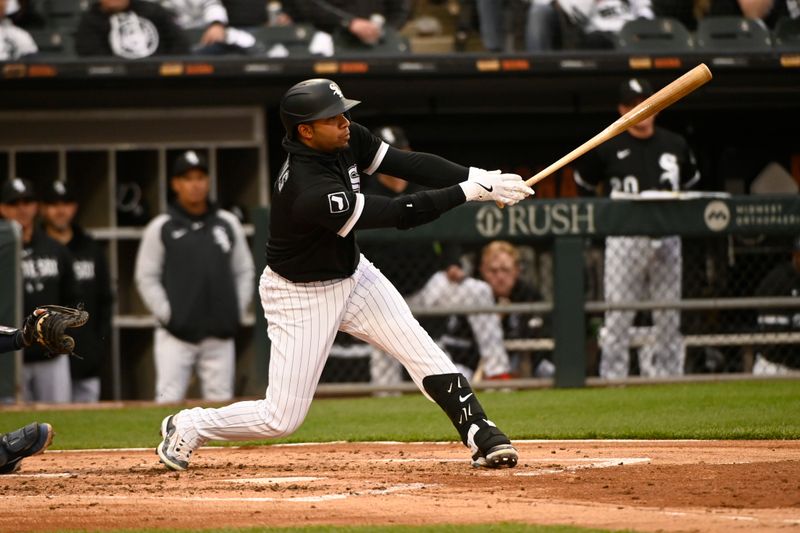 Apr 29, 2023; Chicago, Illinois, USA;  Chicago White Sox second baseman Elvis Andrus (1) hits a two RBI single against the Tampa Bay Rays during the second inning at Guaranteed Rate Field. Mandatory Credit: Matt Marton-USA TODAY Sports