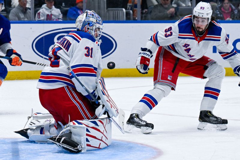 Feb 25, 2025; Elmont, New York, USA;  New York Rangers goaltender Igor Shesterkin (31) makes a save against the New York Islanders during the second period at UBS Arena. Mandatory Credit: Dennis Schneidler-Imagn Images