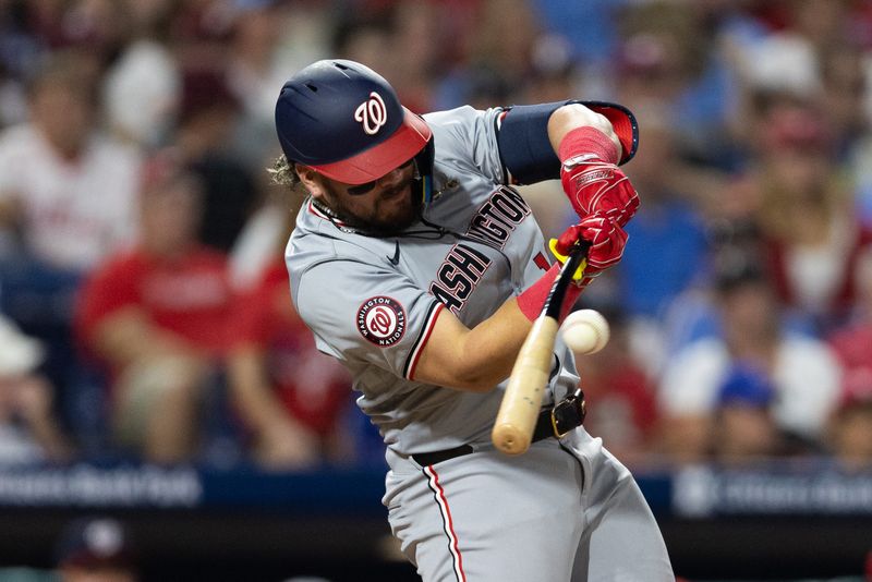 Aug 15, 2024; Philadelphia, Pennsylvania, USA; Washington Nationals third base Andres Chaparro (19) hits a single against the Philadelphia Phillies at Citizens Bank Park. Mandatory Credit: Bill Streicher-USA TODAY Sports