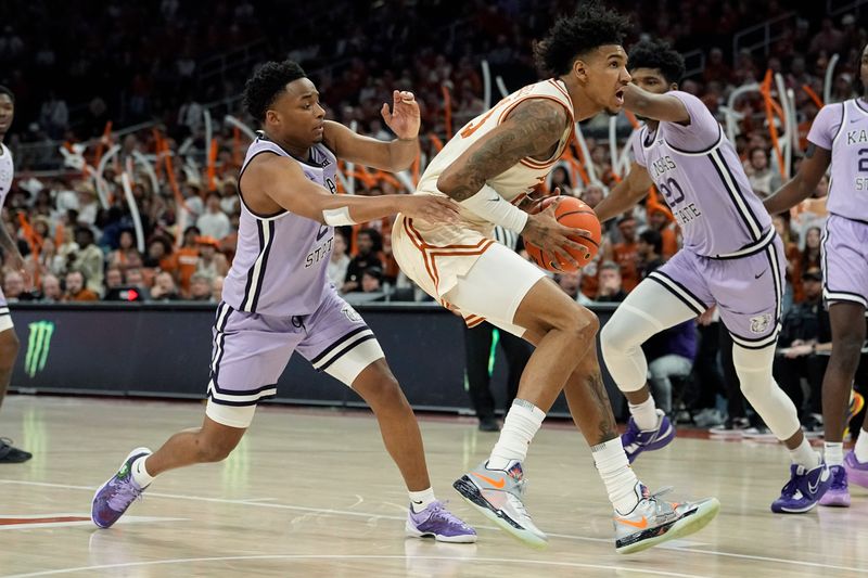 Feb 19, 2024; Austin, Texas, USA; Texas Longhorns forward Dillon Mitchell (23) moves to the basket while defended by Kansas State Wildcats guard Tylor Perry (2) during the first half at Moody Center. Mandatory Credit: Scott Wachter-USA TODAY Sports