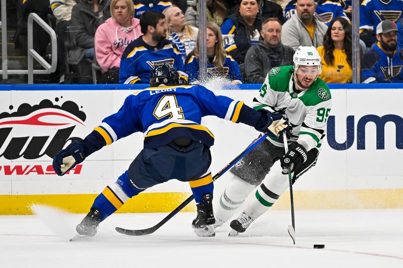 Dec 27, 2023; St. Louis, Missouri, USA;  Dallas Stars center Matt Duchene (95) controls the puck as St. Louis Blues defenseman Nick Leddy (4) defends during the first period at Enterprise Center. Mandatory Credit: Jeff Curry-USA TODAY Sports