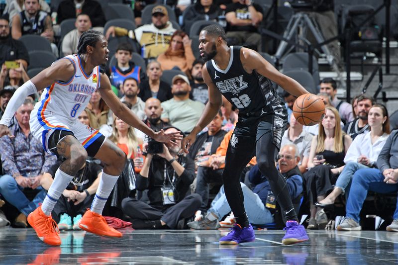 SAN ANTONIO, TX - NOVEMBER 19: Malaki Branham #22 of the San Antonio Spurs dribbles the ball during the game against the Oklahoma City Thunder during the Emirates NBA Cup game on November 19, 2024 at the Frost Bank Center in San Antonio, Texas. NOTE TO USER: User expressly acknowledges and agrees that, by downloading and or using this photograph, user is consenting to the terms and conditions of the Getty Images License Agreement. Mandatory Copyright Notice: Copyright 2024 NBAE (Photos by Michael Gonzales/NBAE via Getty Images)