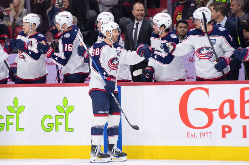 Dec 29, 2025; Ottawa, Ontario, CAN; Columbus Blue Jackets center Boone Jenner (38) celebrates with team his goal scored in the first period against the  Ottawa Senators at the Canadian Tire Centre. Mandatory Credit: Marc DesRosiers-IMAGN Images