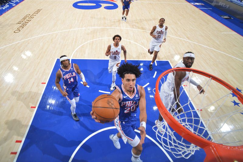 PHILADELPHIA, PA - NOVEMBER 13: Jared McCain #20 of the Philadelphia 76ers drives to the basket during the game against the Cleveland Cavaliers on November 13, 2024 at the Wells Fargo Center in Philadelphia, Pennsylvania NOTE TO USER: User expressly acknowledges and agrees that, by downloading and/or using this Photograph, user is consenting to the terms and conditions of the Getty Images License Agreement. Mandatory Copyright Notice: Copyright 2024 NBAE (Photo by Jesse D. Garrabrant/NBAE via Getty Images)