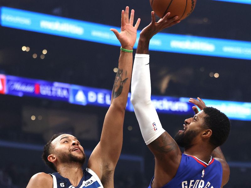 LOS ANGELES, CALIFORNIA - FEBRUARY 28: Paul George #13 of the LA Clippers attempts a shot in front of Kyle Anderson #5 of the Minnesota Timberwolves during a 108-101 Timberwolves win at Crypto.com Arena on February 28, 2023 in Los Angeles, California. NOTE TO USER: User expressly acknowledges and agrees that, by downloading and or using this photograph, user is consenting to the terms and conditions of the Getty Images License Agreement. (Photo by Harry How/Getty Images)