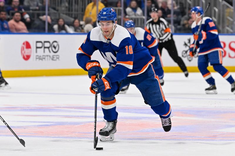 Jan 27, 2024; Elmont, New York, USA; New York Islanders left wing Pierre Engvall (18) skates across the bus line against the Florida Panthers during the second period at UBS Arena. Mandatory Credit: Dennis Schneidler-USA TODAY Sports