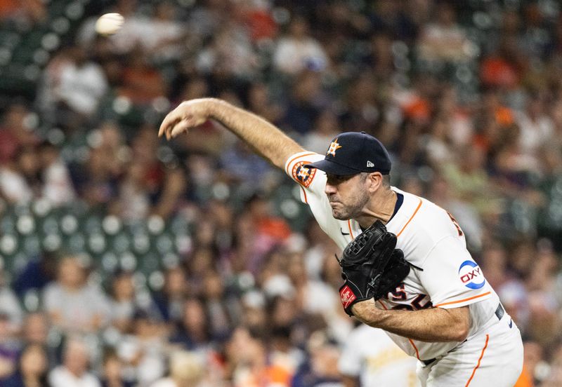 Sep 12, 2023; Houston, Texas, USA Houston Astros starting pitcher Justin Verlander (35) pitches against the Oakland Athletics in the first inning at Minute Maid Park. Mandatory Credit: Thomas Shea-USA TODAY Sports