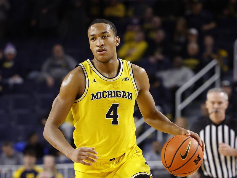 Jan 15, 2024; Ann Arbor, Michigan, USA; Michigan Wolverines guard Nimari Burnett (4) dribbles in the first half against the Ohio State Buckeyes at Crisler Center. Mandatory Credit: Rick Osentoski-USA TODAY Sports