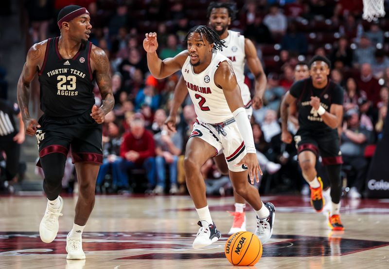 Jan 14, 2023; Columbia, South Carolina, USA; South Carolina Gamecocks guard Chico Carter Jr. (2) brings the ball up past Texas A&M Aggies guard Tyrece Radford (23) in the first half at Colonial Life Arena. Mandatory Credit: Jeff Blake-USA TODAY Sports