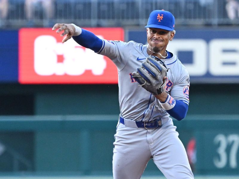 Jul 2, 2024; Washington, District of Columbia, USA; New York Mets shortstop Francisco Lindor (12) throws the ball to first base during the first inning at Nationals Park. Mandatory Credit: Rafael Suanes-USA TODAY Sports