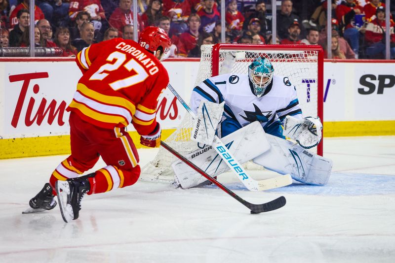 Apr 18, 2024; Calgary, Alberta, CAN; San Jose Sharks goaltender Devin Cooley (1) guards his net against Calgary Flames right wing Matt Coronato (27) during the second period at Scotiabank Saddledome. Mandatory Credit: Sergei Belski-USA TODAY Sports