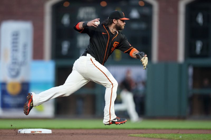 Jun 3, 2023; San Francisco, California, USA;  San Francisco Giants shortstop Brandon Crawford (35) throws the ball to first base during the fifth inning against the Baltimore Orioles at Oracle Park. Mandatory Credit: Darren Yamashita-USA TODAY Sports