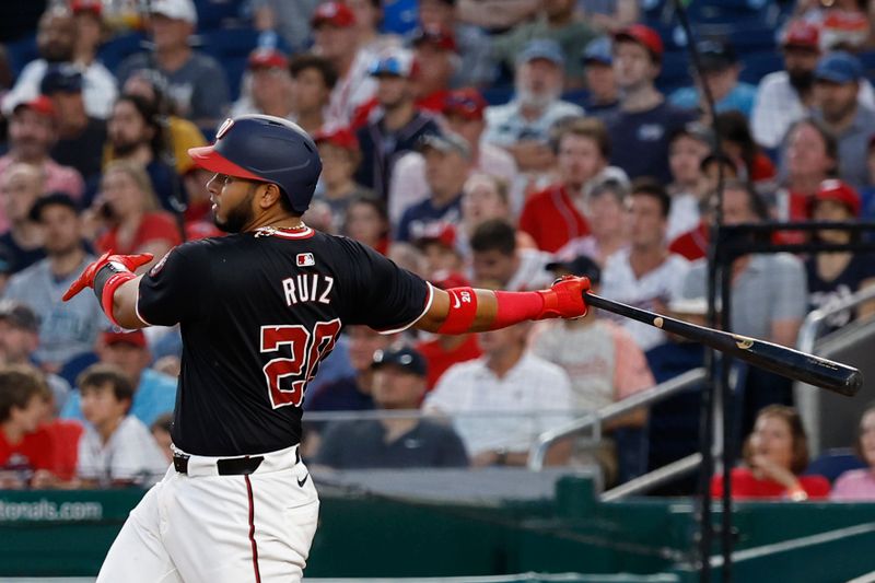 May 24, 2024; Washington, District of Columbia, USA; Washington Nationals catcher Keibert Ruiz (20) hits a two run home run against the Seattle Mariners during the sixth inning at Nationals Park. Mandatory Credit: Geoff Burke-USA TODAY Sports