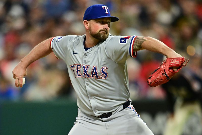 Aug 23, 2024; Cleveland, Ohio, USA; Texas Rangers relief pitcher Kirby Yates (39) throws a pitch during the ninth inning against the Cleveland Guardians at Progressive Field. Mandatory Credit: Ken Blaze-USA TODAY Sports