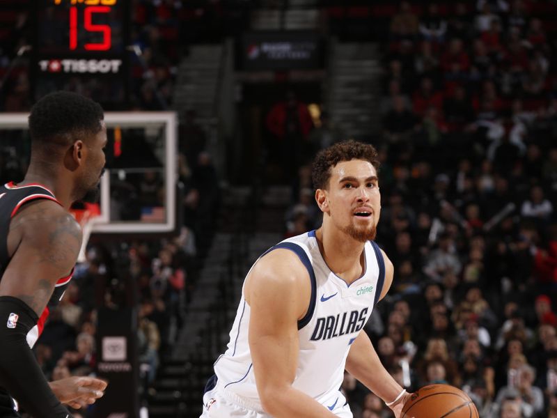 PORTLAND, OR - DECEMBER 1: Dwight Powell #7 of the Dallas Mavericks handles the ball during the game against the Portland Trail Blazers on December 1, 2024 at the Moda Center Arena in Portland, Oregon. NOTE TO USER: User expressly acknowledges and agrees that, by downloading and or using this photograph, user is consenting to the terms and conditions of the Getty Images License Agreement. Mandatory Copyright Notice: Copyright 2024 NBAE (Photo by Cameron Browne/NBAE via Getty Images)