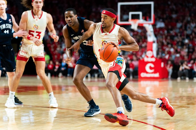 Feb 17, 2024; Lincoln, Nebraska, USA; Nebraska Cornhuskers guard Jamarques Lawrence (10) drives against Penn State Nittany Lions guard Jameel Brown (5) during the first half at Pinnacle Bank Arena. Mandatory Credit: Dylan Widger-USA TODAY Sports