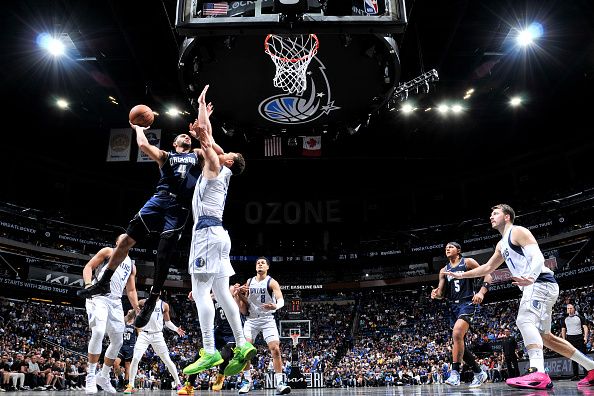 ORLANDO, FL - NOVEMBER 6: Jalen Suggs #4 of the Orlando Magic drives to the basket during the game against the Dallas Mavericks on November 6, 2023 at Amway Center in Orlando, Florida. NOTE TO USER: User expressly acknowledges and agrees that, by downloading and or using this photograph, User is consenting to the terms and conditions of the Getty Images License Agreement. Mandatory Copyright Notice: Copyright 2023 NBAE (Photo by Fernando Medina/NBAE via Getty Images)