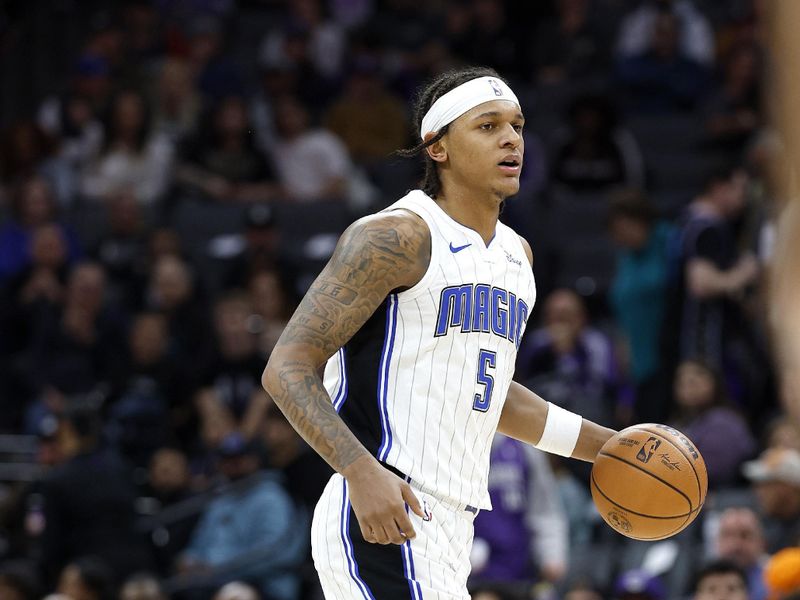 SACRAMENTO, CALIFORNIA - JANUARY 03: Paolo Banchero #5 of the Orlando Magic dribbles the ball up court against the Sacramento Kings during the second half of an NBA basketball game at Golden 1 Center on January 03, 2024 in Sacramento, California. NOTE TO USER: User expressly acknowledges and agrees that, by downloading and or using this photograph, User is consenting to the terms and conditions of the Getty Images License Agreement. (Photo by Thearon W. Henderson/Getty Images)