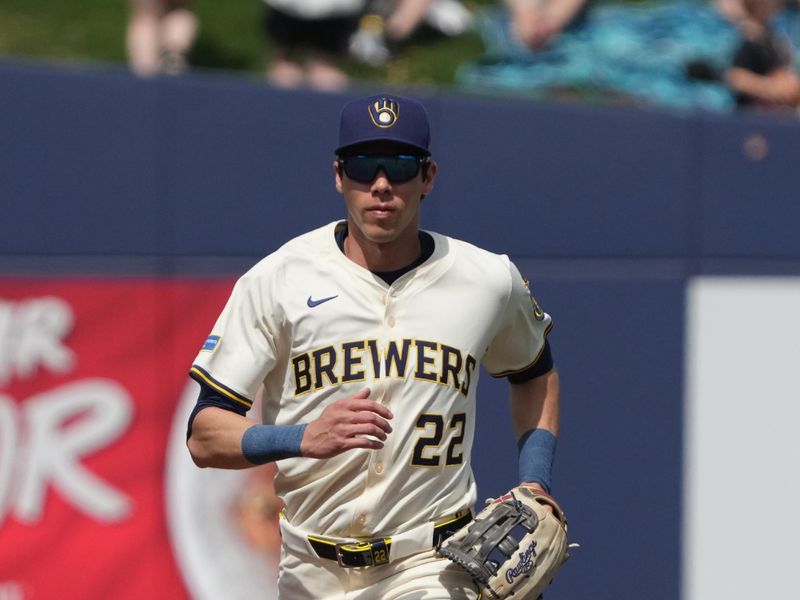 Mar 16, 2025; Phoenix, Arizona, USA; Milwaukee Brewers outfielder Christian Yelich (22) makes the play against the Cleveland Guardians in the first inning at American Family Fields of Phoenix. Mandatory Credit: Rick Scuteri-Imagn Images