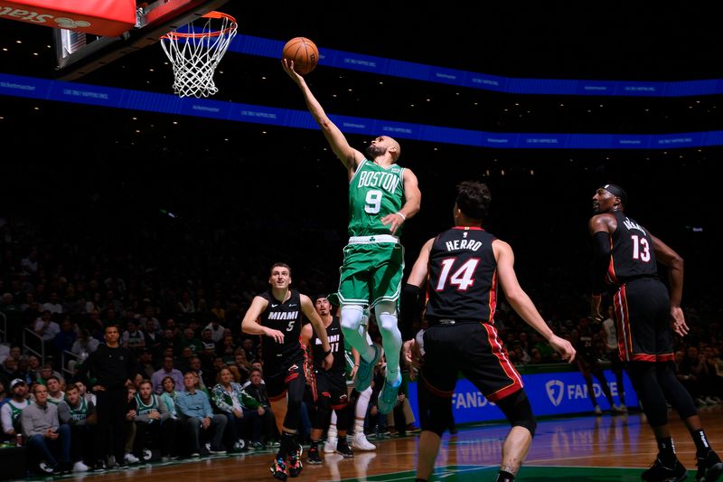 BOSTON, MA - APRIL 24: Derrick White #9 of the Boston Celtics goes to the basket during the game against the Miami Heat during Round 1 Game 2 of the 2024 NBA Playoffs on April 24, 2024 at the TD Garden in Boston, Massachusetts. NOTE TO USER: User expressly acknowledges and agrees that, by downloading and or using this photograph, User is consenting to the terms and conditions of the Getty Images License Agreement. Mandatory Copyright Notice: Copyright 2024 NBAE  (Photo by Brian Babineau/NBAE via Getty Images)