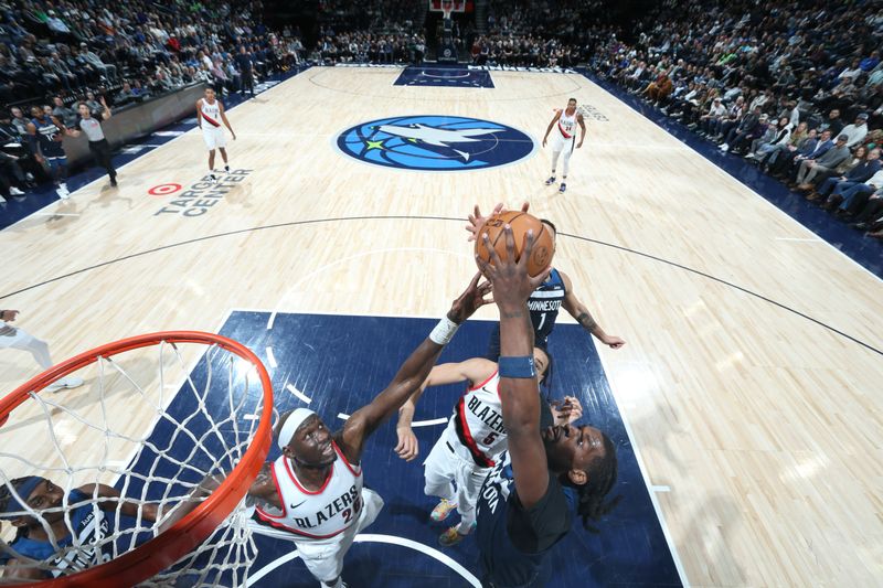 MINNEAPOLIS, MN -  MARCH 4: Naz Reid #11 of the Minnesota Timberwolves grabs a rebound during the game against the Portland Trail Blazers on March 4, 2024 at Target Center in Minneapolis, Minnesota. NOTE TO USER: User expressly acknowledges and agrees that, by downloading and or using this Photograph, user is consenting to the terms and conditions of the Getty Images License Agreement. Mandatory Copyright Notice: Copyright 2024 NBAE (Photo by David Sherman/NBAE via Getty Images)