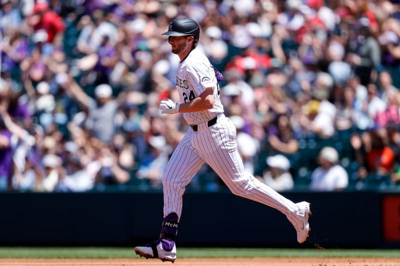 May 26, 2024; Denver, Colorado, USA; Colorado Rockies third baseman Ryan McMahon (24) rounds the bases on a two run home run in the first inning against the Philadelphia Phillies at Coors Field. Mandatory Credit: Isaiah J. Downing-USA TODAY Sports