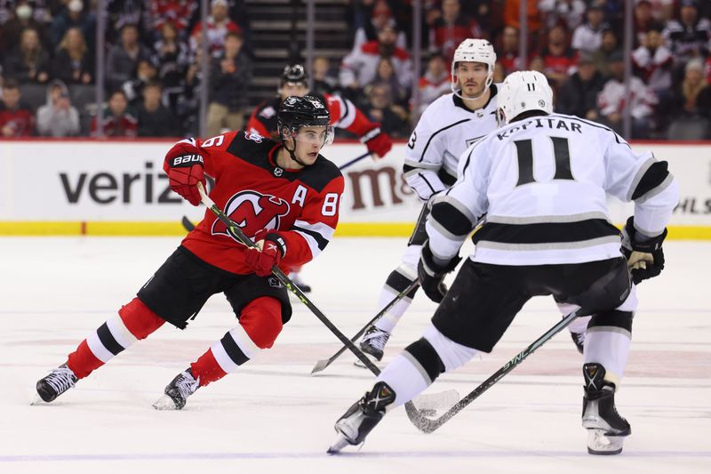 Feb 23, 2023; Newark, New Jersey, USA; New Jersey Devils center Jack Hughes (86) skates with the puck against the Los Angeles Kings during overtime at Prudential Center. Mandatory Credit: Ed Mulholland-USA TODAY Sports