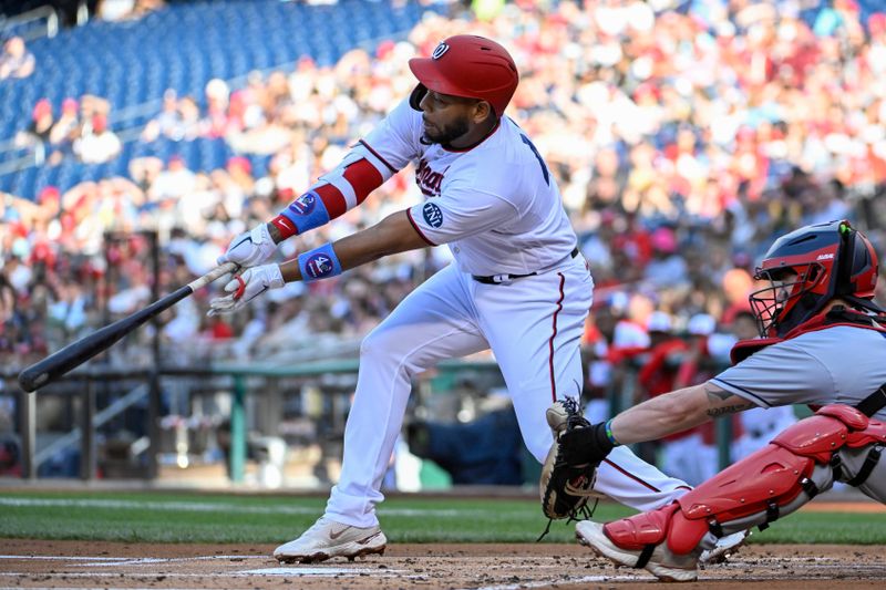 Apr 15, 2023; Washington, District of Columbia, USA; Washington Nationals first baseman Dominic Smith (22) hits a single against the Cleveland Guardians during the first inning at Nationals Park. Mandatory Credit: Brad Mills-USA TODAY Sports