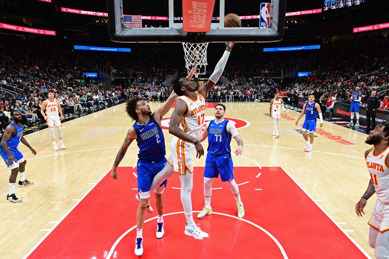 ATLANTA, GA - JANUARY 26: Onyeka Okongwu #17 of the Atlanta Hawks drives to the basket during the game against the Dallas Mavericks on January 26, 2024 at State Farm Arena in Atlanta, Georgia.  NOTE TO USER: User expressly acknowledges and agrees that, by downloading and/or using this Photograph, user is consenting to the terms and conditions of the Getty Images License Agreement. Mandatory Copyright Notice: Copyright 2024 NBAE (Photo by Adam Hagy/NBAE via Getty Images)