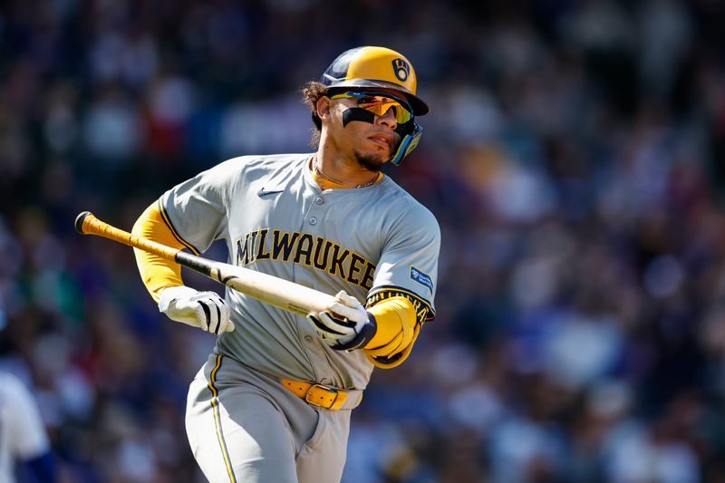 May 3, 2024; Chicago, Illinois, USA; Milwaukee Brewers catcher William Contreras (24) runs to first base after hitting an RBI-single against the Chicago Cubs during the eight inning at Wrigley Field. Mandatory Credit: Kamil Krzaczynski-USA TODAY Sports