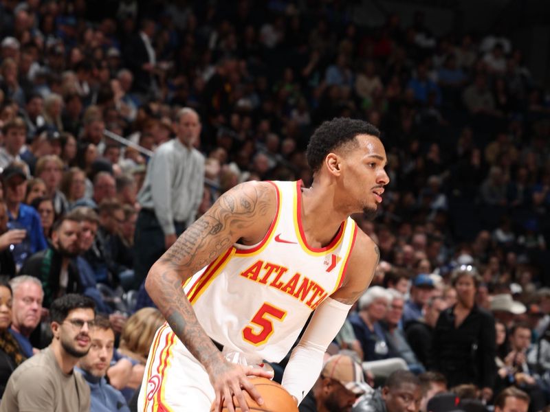 MINNEAPOLIS, MN -  APRIL 12: Dejounte Murray #5 of the Atlanta Hawks handles the ball during the game against the Minnesota Timberwolves on April 12, 2024 at Target Center in Minneapolis, Minnesota. NOTE TO USER: User expressly acknowledges and agrees that, by downloading and or using this Photograph, user is consenting to the terms and conditions of the Getty Images License Agreement. Mandatory Copyright Notice: Copyright 2024 NBAE (Photo by David Sherman/NBAE via Getty Images)