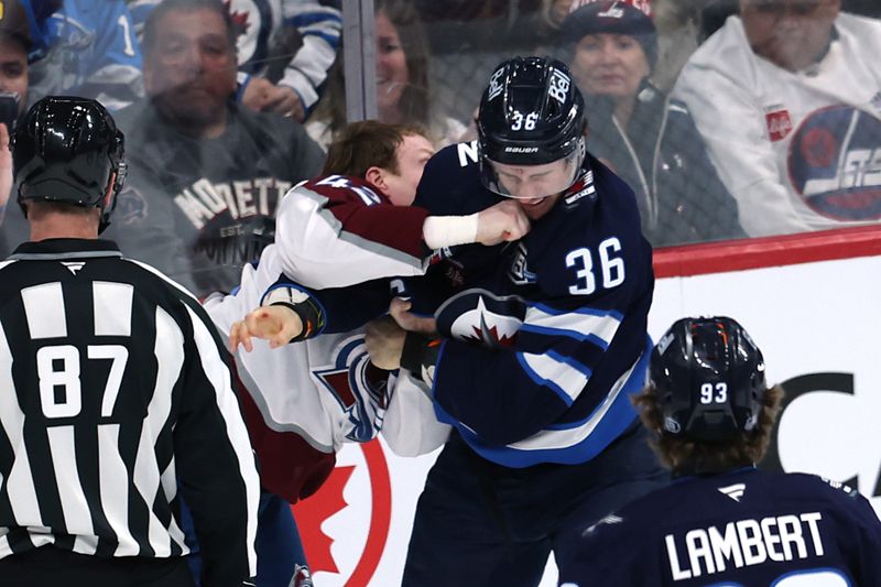 Mar 26, 2026; Winnipeg, Manitoba, CAN; Colorado Avalanche defenseman Josh Manson (42) fights with Winnipeg Jets center Morgan Barron (36) in the third period at Canada Life Centre. Mandatory Credit: James Carey Lauder-Imagn Images