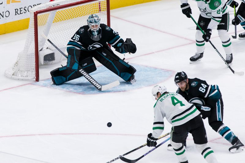 Mar 5, 2024; San Jose, California, USA; Dallas Stars defenseman Miro Heiskanen (4) shoots against San Jose Sharks goaltender Kaapo Kahkonen (36) during the third period at SAP Center at San Jose. Mandatory Credit: John Hefti-USA TODAY Sports