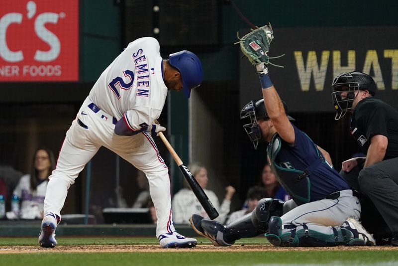 May 3, 2025; Arlington, Texas, USA; Texas Rangers second baseman Marcus Semien (2) gets out of the way of an inside pitch during the ninth inning against the Seattle Mariners at Globe Life Field. Mandatory Credit: Raymond Carlin III-Imagn Images