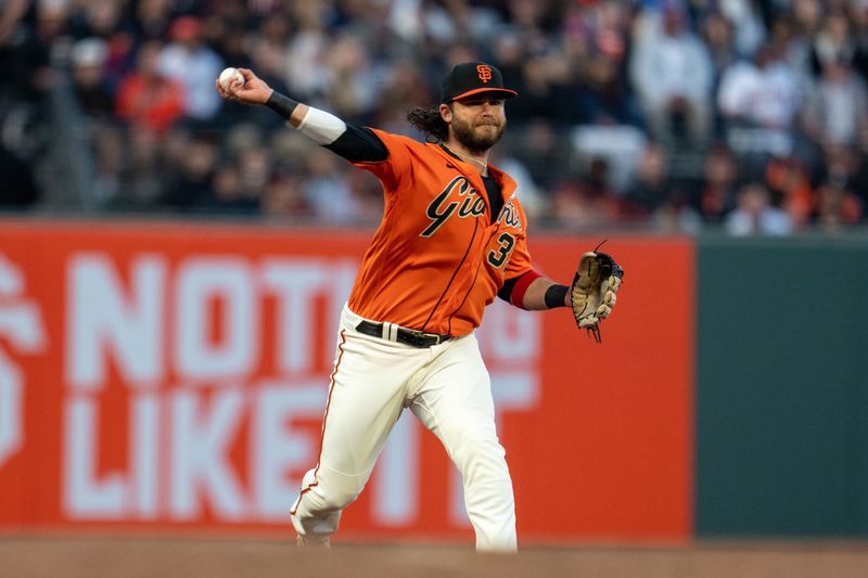 Jun 2, 2023; San Francisco, California, USA;  San Francisco Giants shortstop Brandon Crawford (35) throws out Baltimore Orioles left fielder Austin Hays (21) during the third inning at Oracle Park. Mandatory Credit: Neville E. Guard-USA TODAY Sports