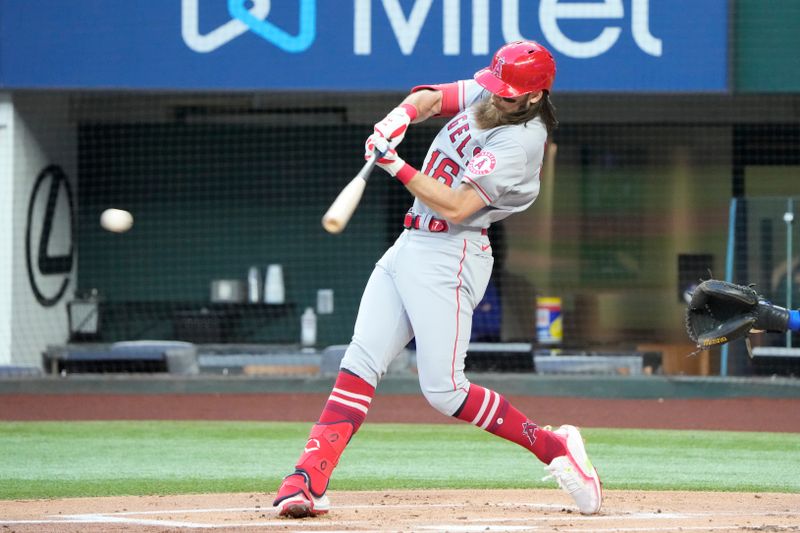 Apr 14, 2022; Arlington, Texas, USA; Los Angeles Angels left fielder Brandon Marsh (16) hits for an RBI single during the first inning of a baseball game against the Texas Rangers at Globe Life Field. Mandatory Credit: Jim Cowsert-USA TODAY Sports