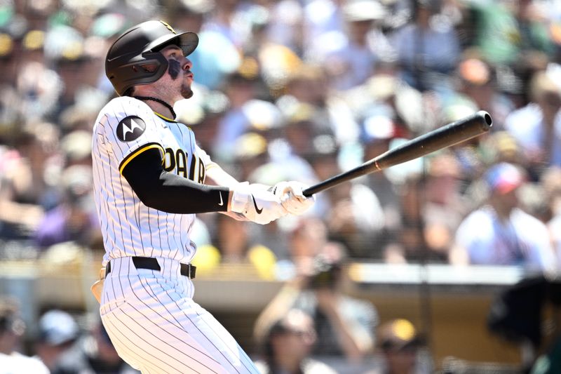 Jun 12, 2024; San Diego, California, USA; San Diego Padres center fielder Jackson Merrill (3) hits a home run against the Oakland Athletics during the fifth inning at Petco Park. Mandatory Credit: Orlando Ramirez-USA TODAY Sports