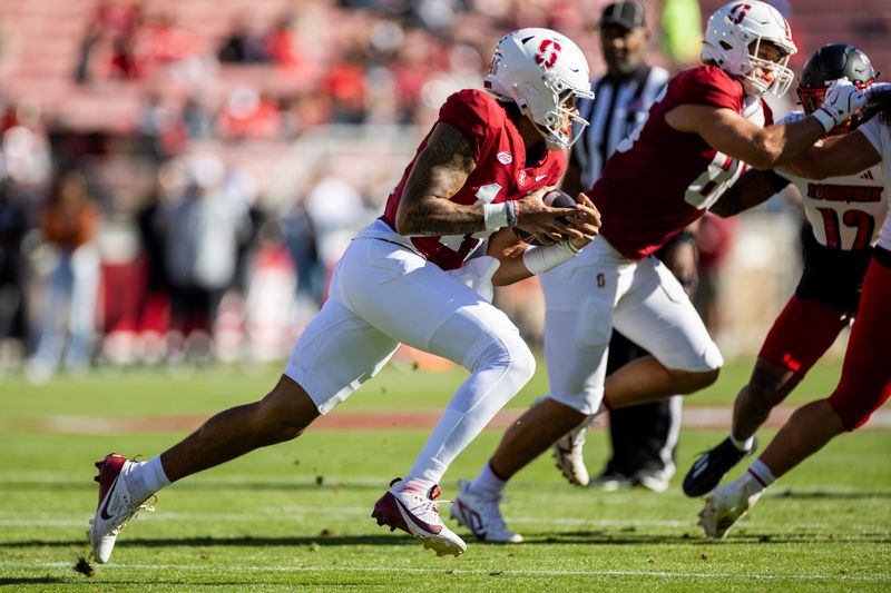 Nov 16, 2024; Stanford, California, USA; Stanford Cardinal quarterback Ashton Daniels (14) scrambles during the first quarter against the Louisville Cardinals at Stanford Stadium. Mandatory Credit: Bob Kupbens-Imagn Images