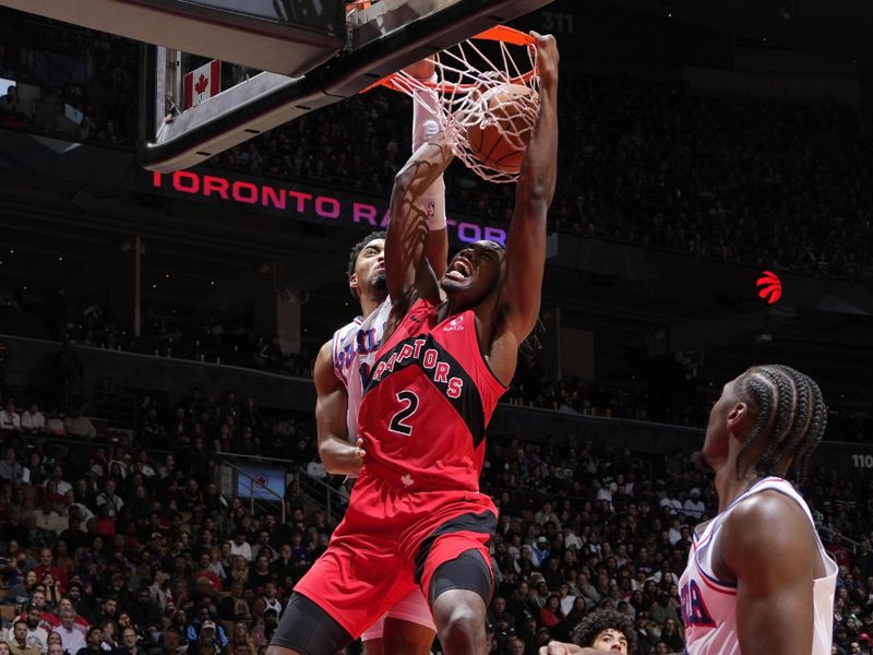 TORONTO, CANADA - OCTOBER 25: Jonathan Mogbo #2 of the Toronto Raptors dunks the ball during the game against the Philadelphia 76ers on October 25, 2024 at the Scotiabank Arena in Toronto, Ontario, Canada.  NOTE TO USER: User expressly acknowledges and agrees that, by downloading and or using this Photograph, user is consenting to the terms and conditions of the Getty Images License Agreement.  Mandatory Copyright Notice: Copyright 2024 NBAE (Photo by Mark Blinch/NBAE via Getty Images)