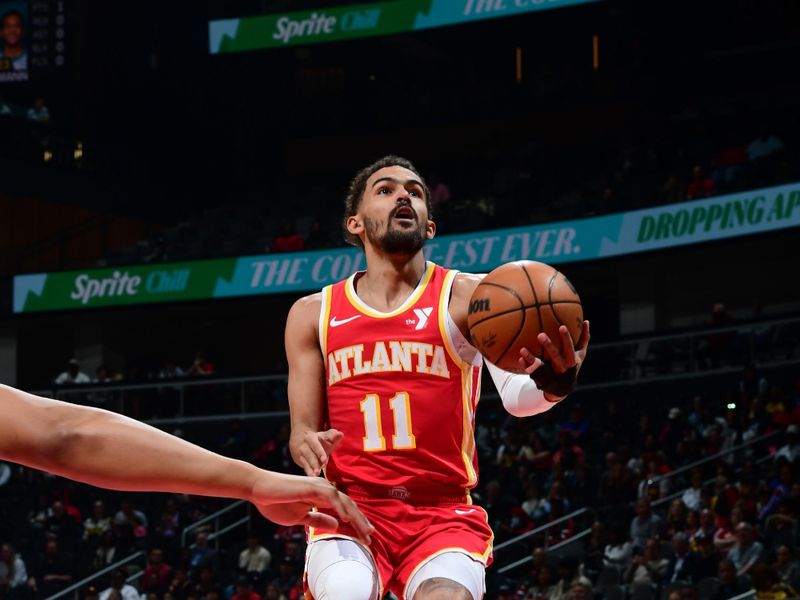 ATLANTA, GA - APRIL 10: Trae Young #11 of the Atlanta Hawks drives to the basket during the game against the Charlotte Hornets on April 10, 2024 at State Farm Arena in Atlanta, Georgia.  NOTE TO USER: User expressly acknowledges and agrees that, by downloading and/or using this Photograph, user is consenting to the terms and conditions of the Getty Images License Agreement. Mandatory Copyright Notice: Copyright 2024 NBAE (Photo by Scott Cunningham/NBAE via Getty Images)