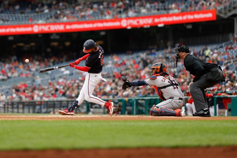 Apr 21, 2024; Washington, District of Columbia, USA; Washington Nationals outfielder Jesse Winker (6) hits an RBI single against the Houston Astros during the first inning at Nationals Park. Mandatory Credit: Geoff Burke-USA TODAY Sports