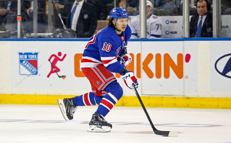 Apr 5, 2023; New York, New York, USA; New York Rangers left wing Artemi Panarin (10) skates with the puck against the Tampa Bay Lightning during the third period at Madison Square Garden. Mandatory Credit: Danny Wild-USA TODAY Sports